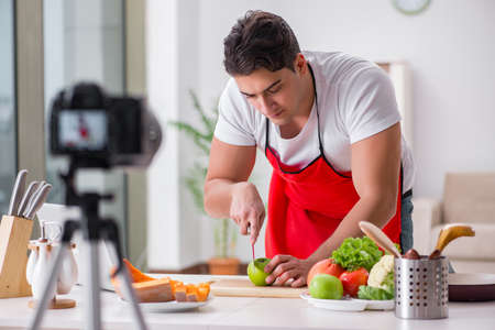 Food blogger working in the kitchenの写真素材