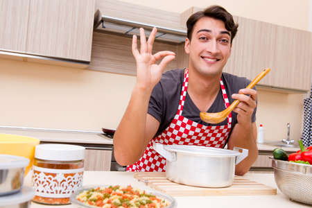 Man male cook preparing food in kitchenの写真素材
