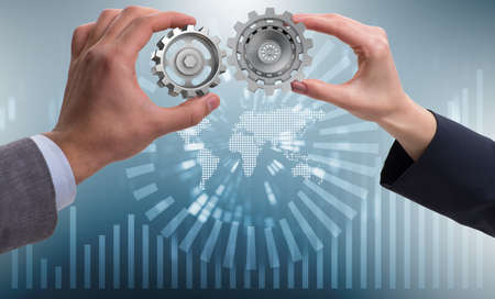 Businessman in teamwork concept with cogwheels
