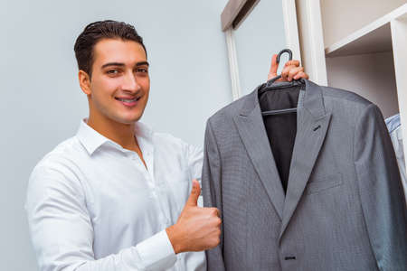 Businessman dressing up for workの写真素材