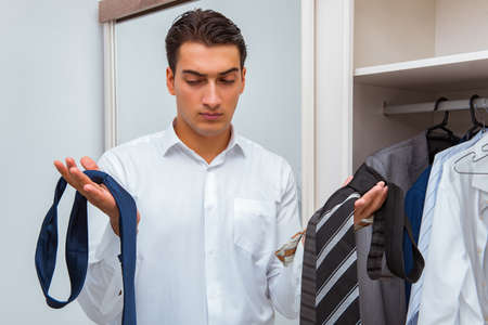 Businessman dressing up for workの写真素材