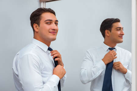 Businessman dressing up for workの写真素材