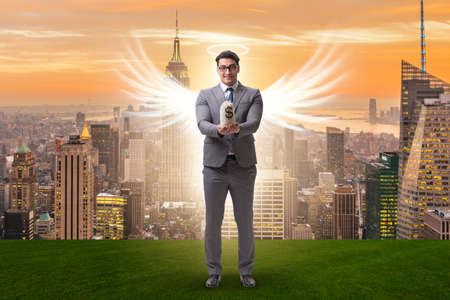 Angel investor concept with businessman with wingsの写真素材