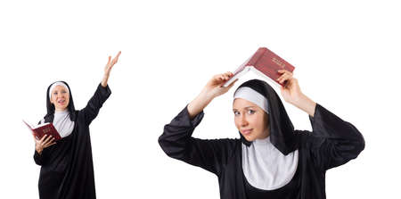 Pretty nun with Bible isolated on whiteの写真素材