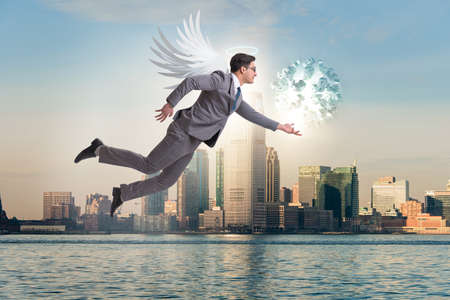 Angel investor concept with businessman with wingsの写真素材