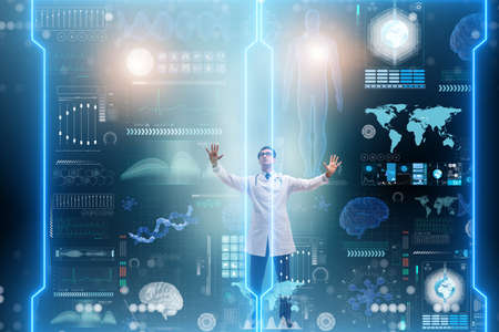 Doctor in futuristic medical concept pressing buttonの写真素材