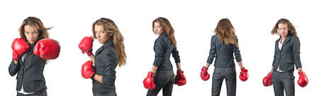 Young woman with boxing gloves isolated on whiteの写真素材
