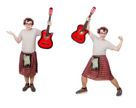 Scotsman playing guitar isolated on whiteの写真素材
