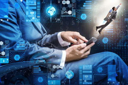 Businessman with smartphone in startup conceptの写真素材