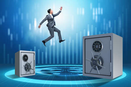 Businessman jumping from safes in business concept