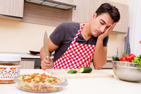 Man male cook preparing food in kitchenの写真素材