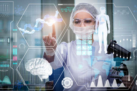 Doctor in futuristic medical concept pressing button