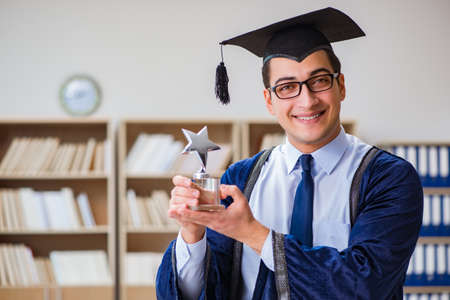 Young man graduating from universityの写真素材