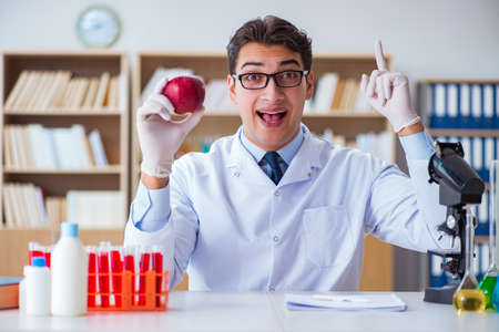 Scientist working on organic fruits and vegetablesの写真素材