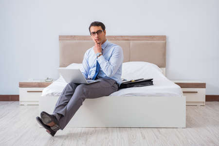 Businessman in the hotel room during travelの写真素材