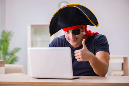 Digital security concept with pirate at computerの写真素材