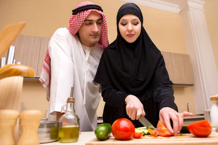 Young arab family in the kitchenの写真素材