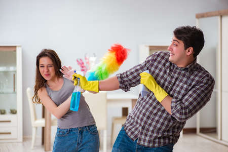 Wife and husband doing cleaning at homeの写真素材