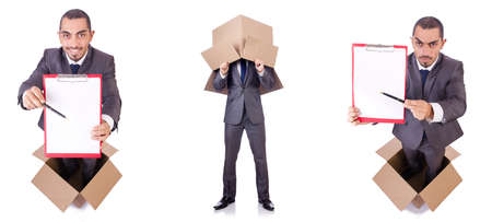 Businessman standing in the box isolated on whiteの写真素材