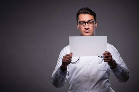 Young doctor working on tablet computerの写真素材