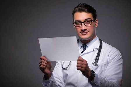 Young doctor working on tablet computerの写真素材