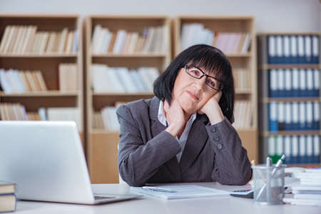 Mature businesswoman working in the officeの写真素材