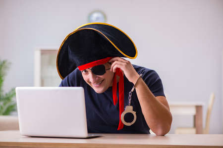 Digital security concept with pirate at computerの写真素材