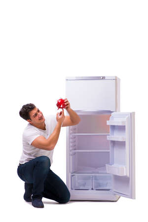 Hungry man looking for money to fill the fridgeの写真素材