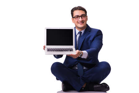 Businessman sitting on the floor isolated on whiteの写真素材