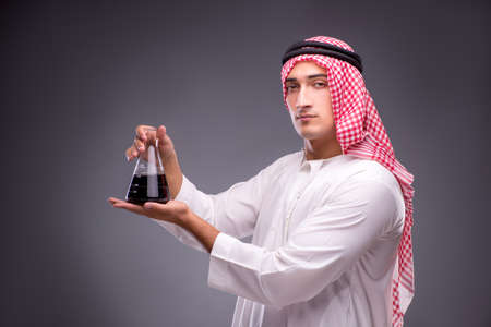 Arab with oil on gray backgroundの写真素材