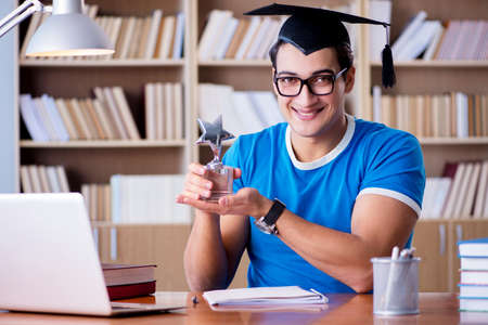 Young man graduating from universityの写真素材