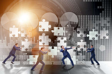 Business concept of teamwork with puzzle piecesの写真素材