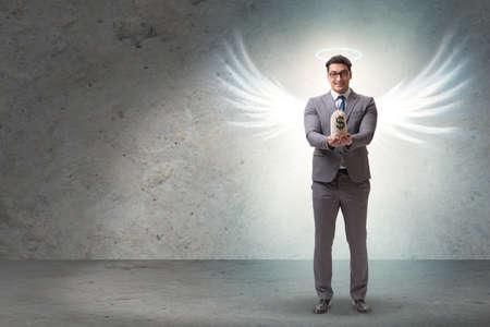 Angel investor concept with businessman with wingsの写真素材