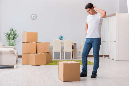 Man caryying boxes at home
