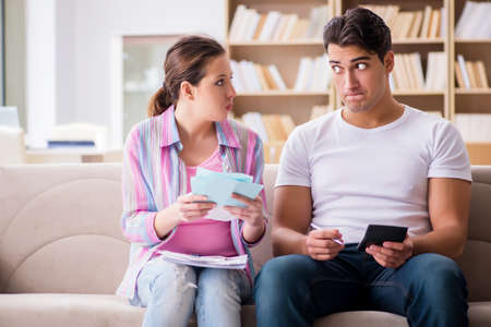 Young family discussing family financesの写真素材