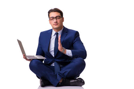 Businessman sitting on the floor isolated on whiteの写真素材
