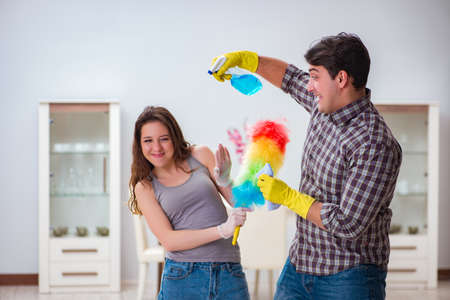 Wife and husband doing cleaning at home