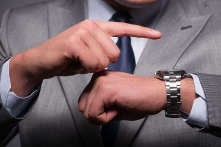 Businessman in time management conceptの写真素材