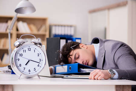 Businessman failing to meet the deadlinesの写真素材