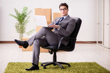 Businessman sitting on the chair in officeの写真素材