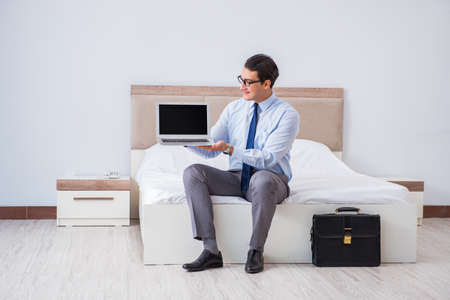 Businessman in the hotel room during travelの写真素材
