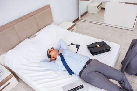 Businessman in the hotel room during travelの写真素材