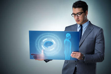 Futuristic remote diagnostics concept with businessmanの写真素材
