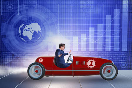 Businessman driving car in financial conceptの写真素材