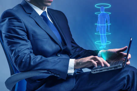 Futuristic remote diagnostics concept with businessmanの写真素材