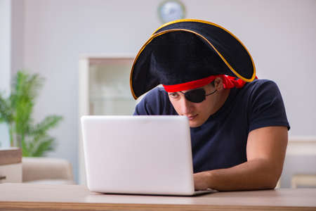 Digital security concept with pirate at computerの写真素材