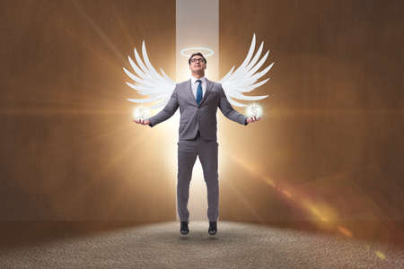 Angel investor concept with businessman with wingsの写真素材
