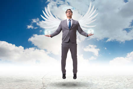 Angel investor concept with businessman with wingsの写真素材