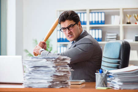 Angry aggressive businessman in the officeの写真素材