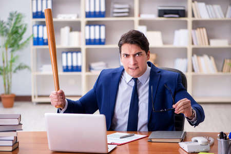 Angry aggressive businessman in the officeの写真素材